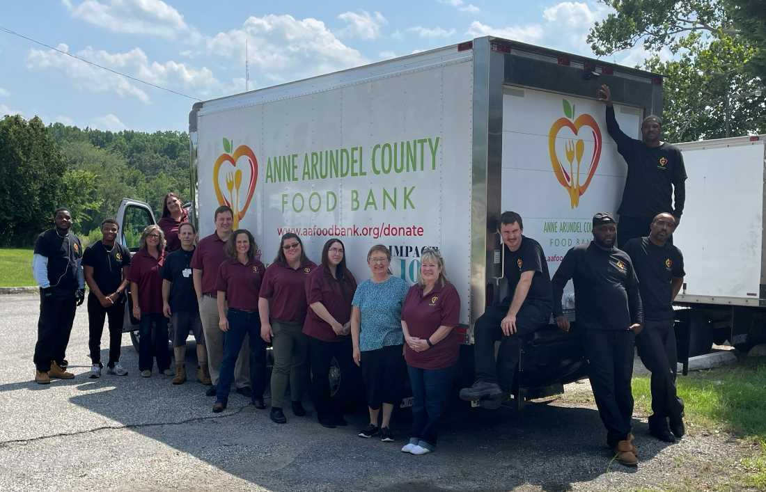 Anne Arundel County Food Bank staff standing in front of our delivery truck.